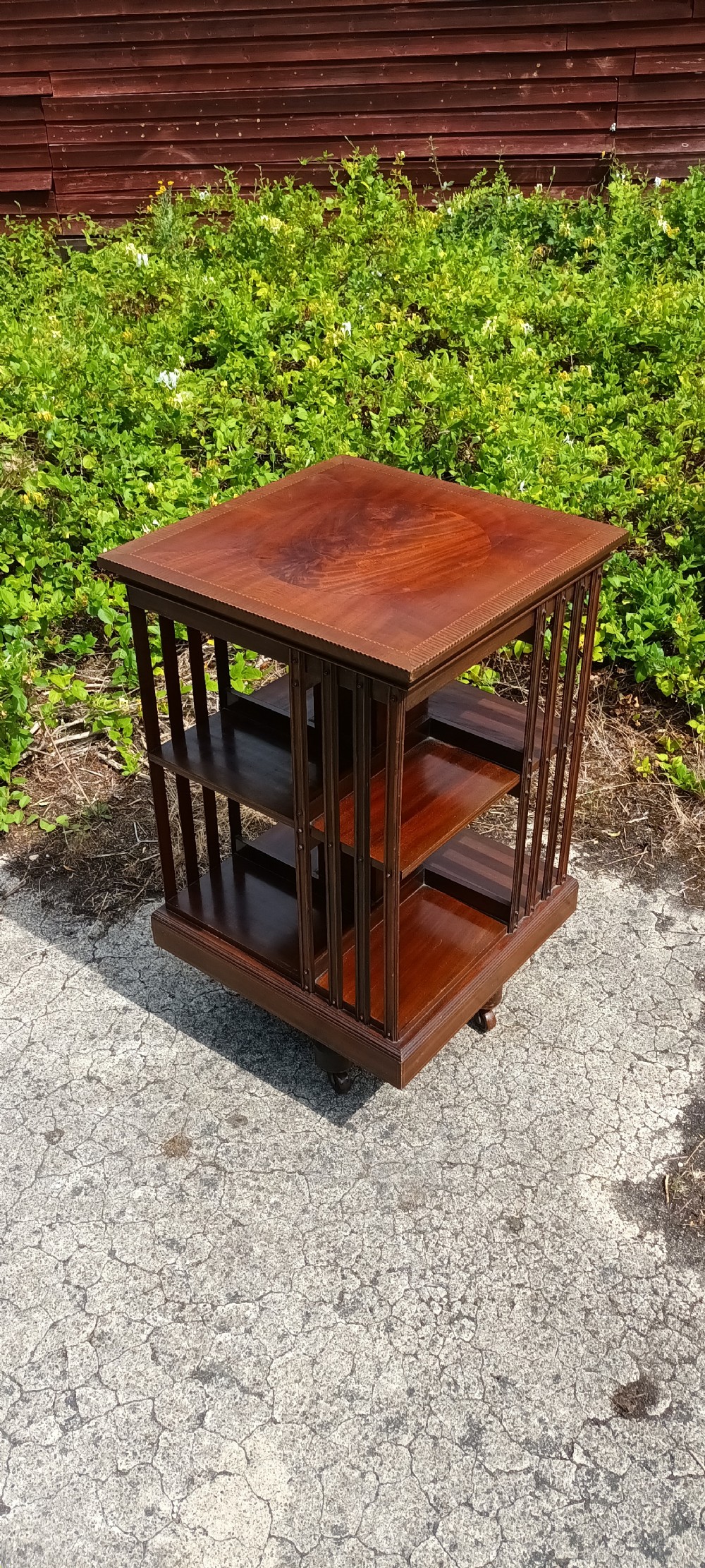 Edwardian inlaid revolving bookcase with metal base . View III