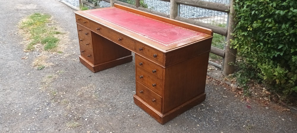 6 foot Victorian oak kneehole pedestal writing desk. View IV