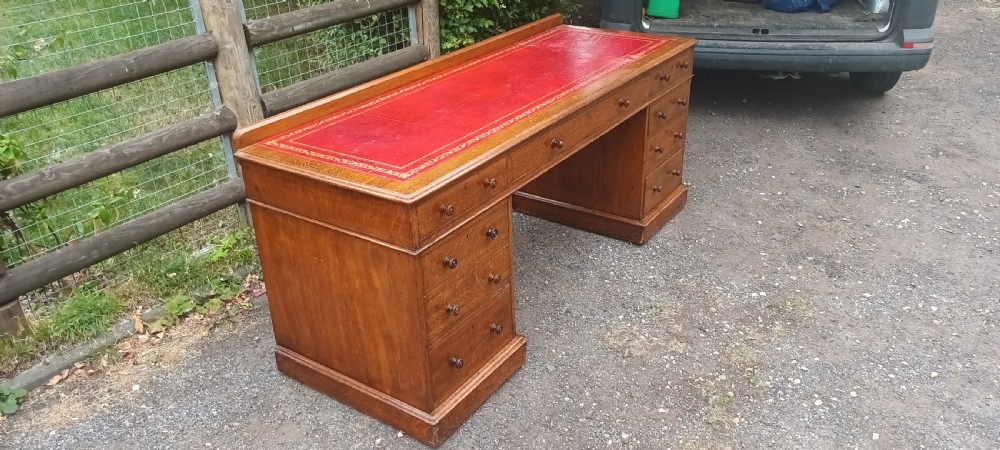 6 foot Victorian oak kneehole pedestal writing desk. View V