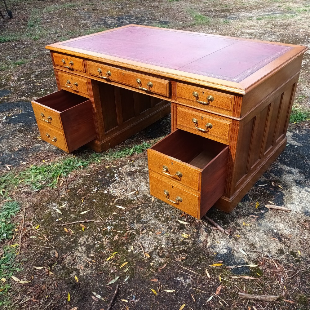 Early 20th century panelled oak kneehole pedestal desk.  View X