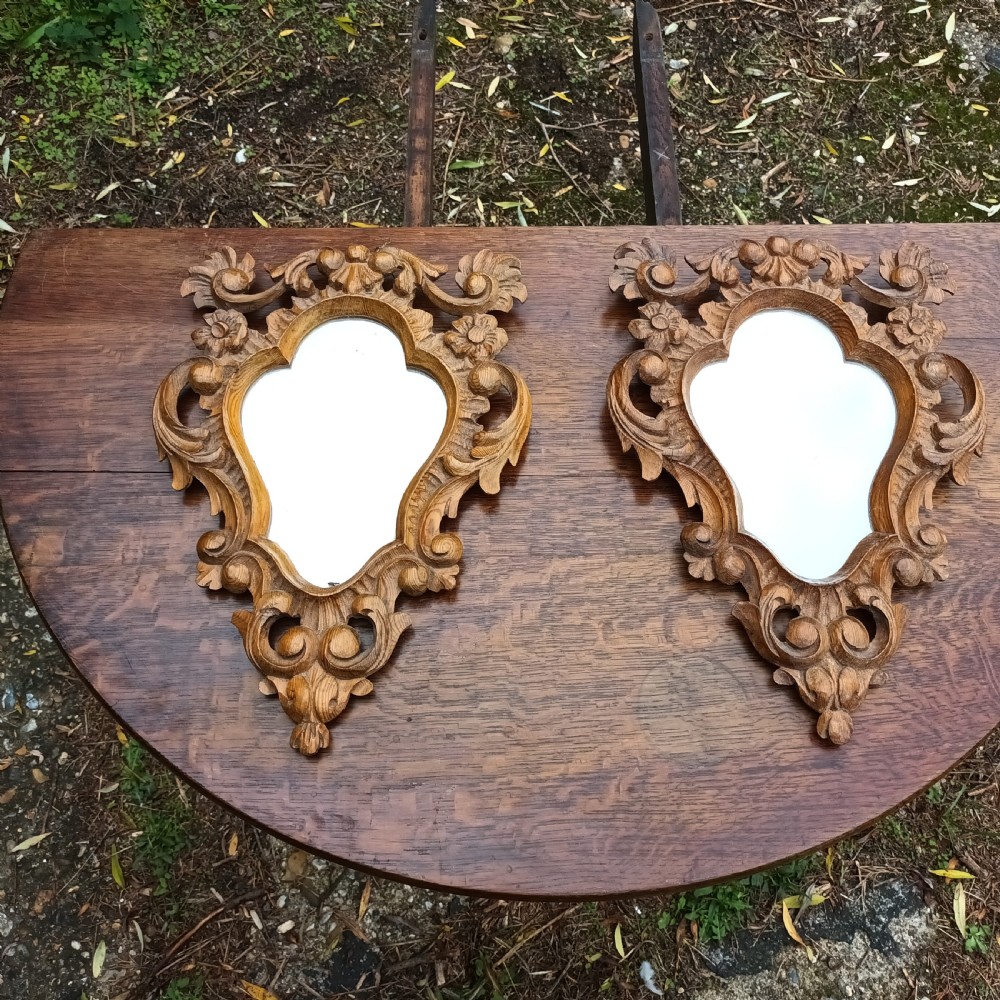 Pair of small carved pine wall mirrors. 