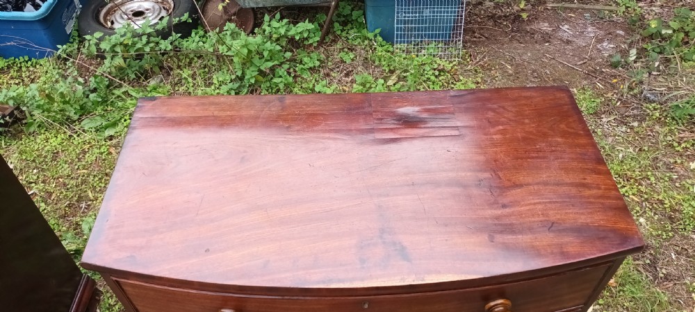 Early Victorian mahogany bow front chest of drawers.  View V