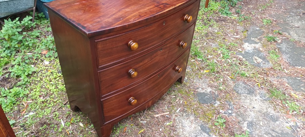 Early Victorian mahogany bow front chest of drawers.  View VI