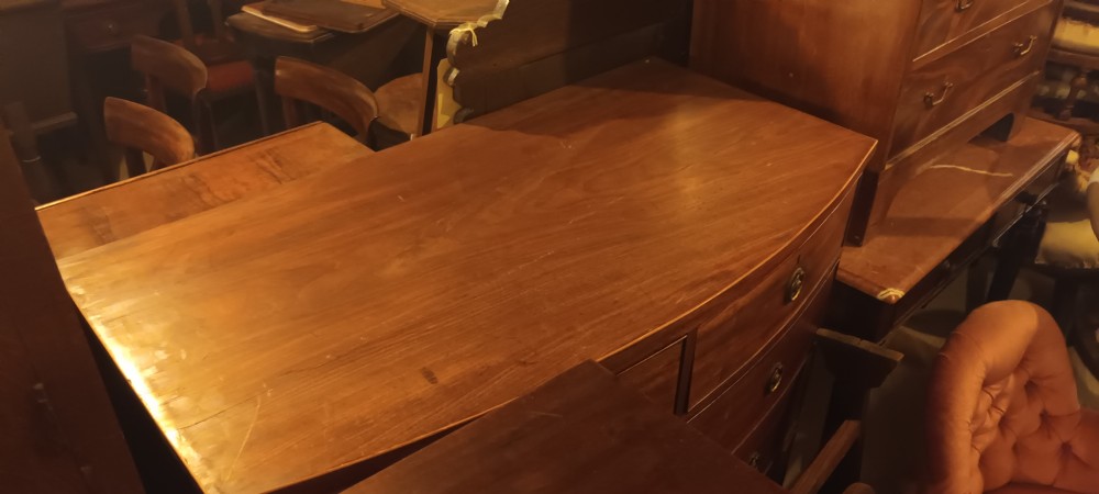 Late Georgian mahogany bow front chest of drawers.  View IX