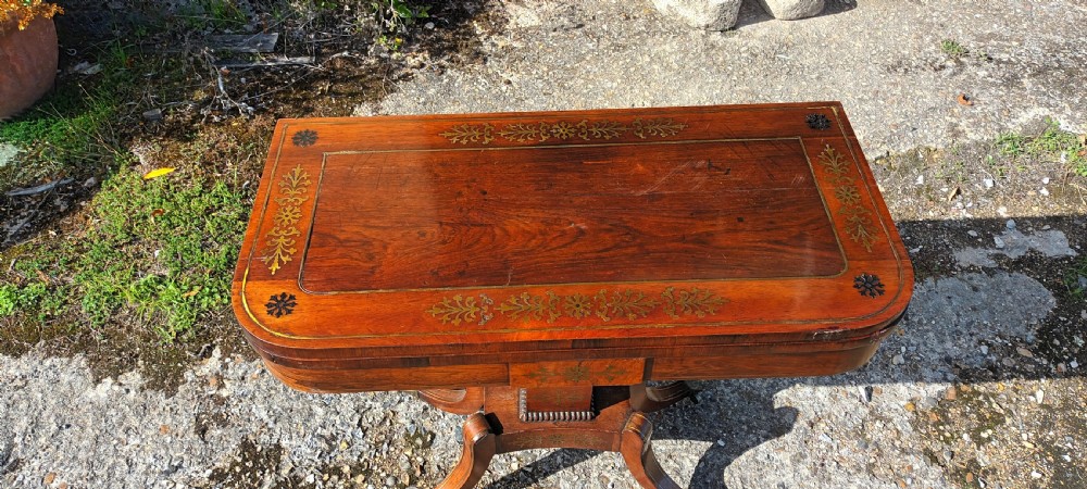 Regency brass inlaid rosewood games table. View X