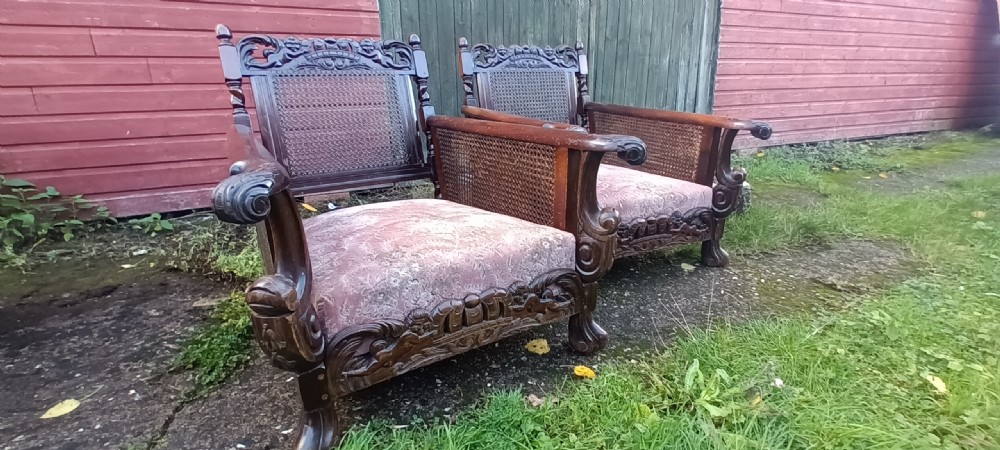 Pair of carved Mahogany framed bergere armchairs. 