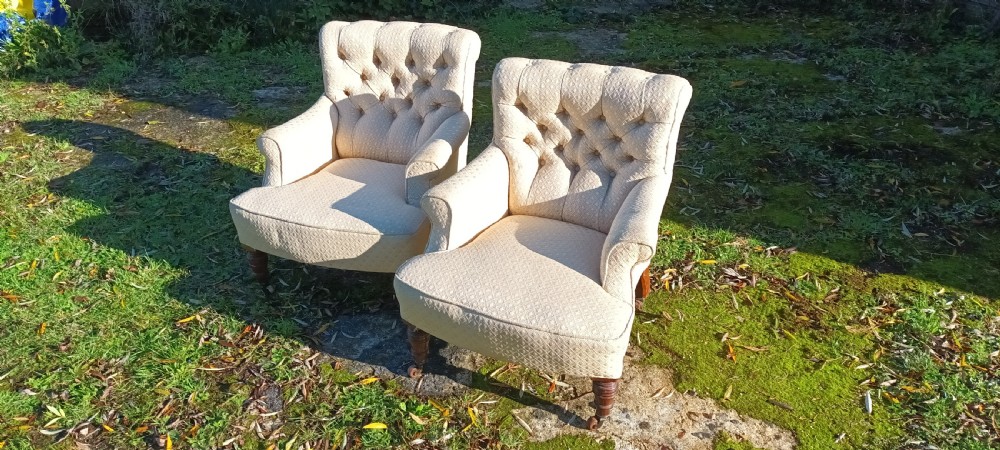 Matched pair of Victorian upholstered bedroom chairs.