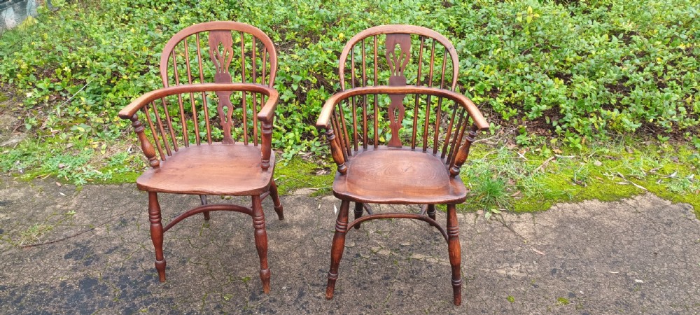 A close pair of Windsor armchairs. 