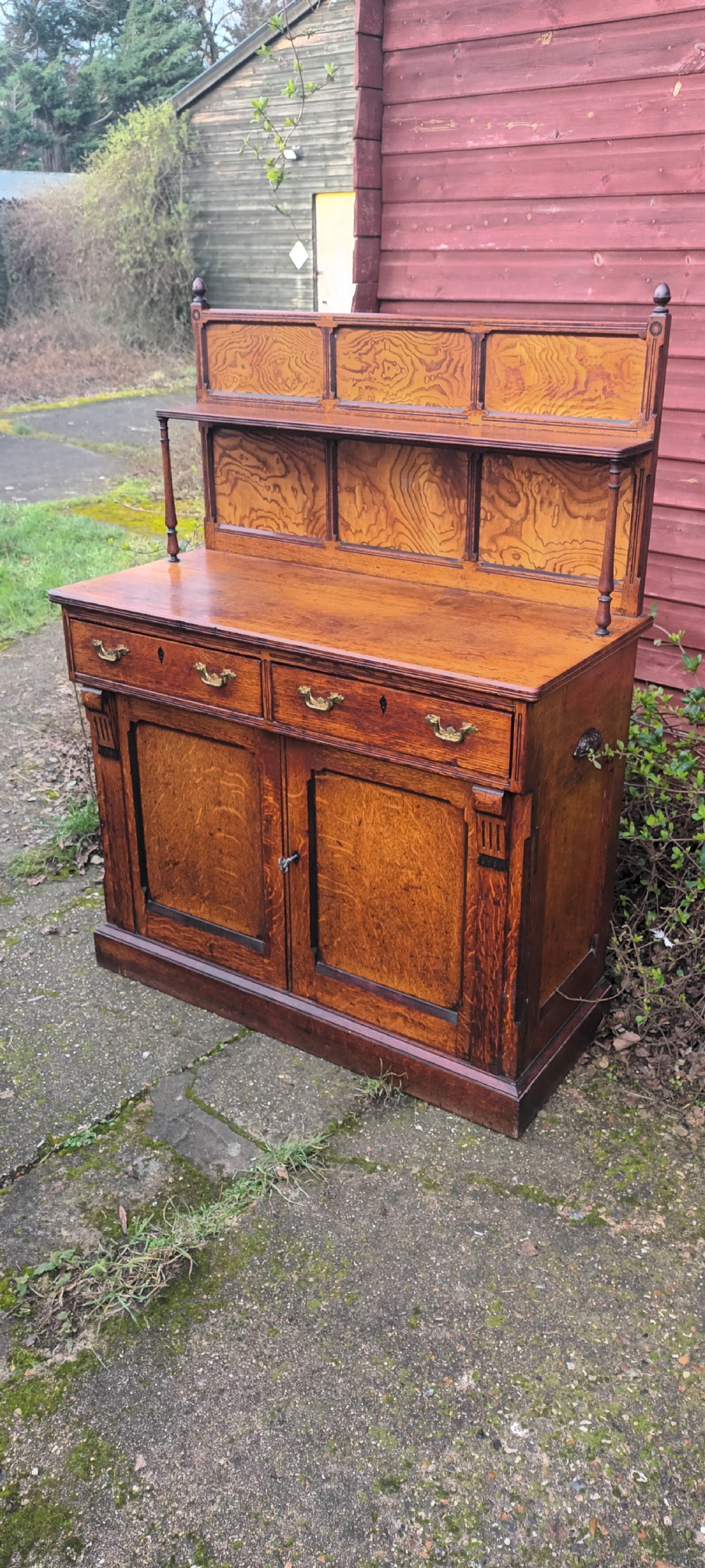 Neat Victorian oak side cabinet with stamped locks. 