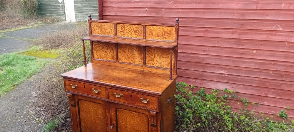 Neat Victorian oak side cabinet with stamped locks.  View VI