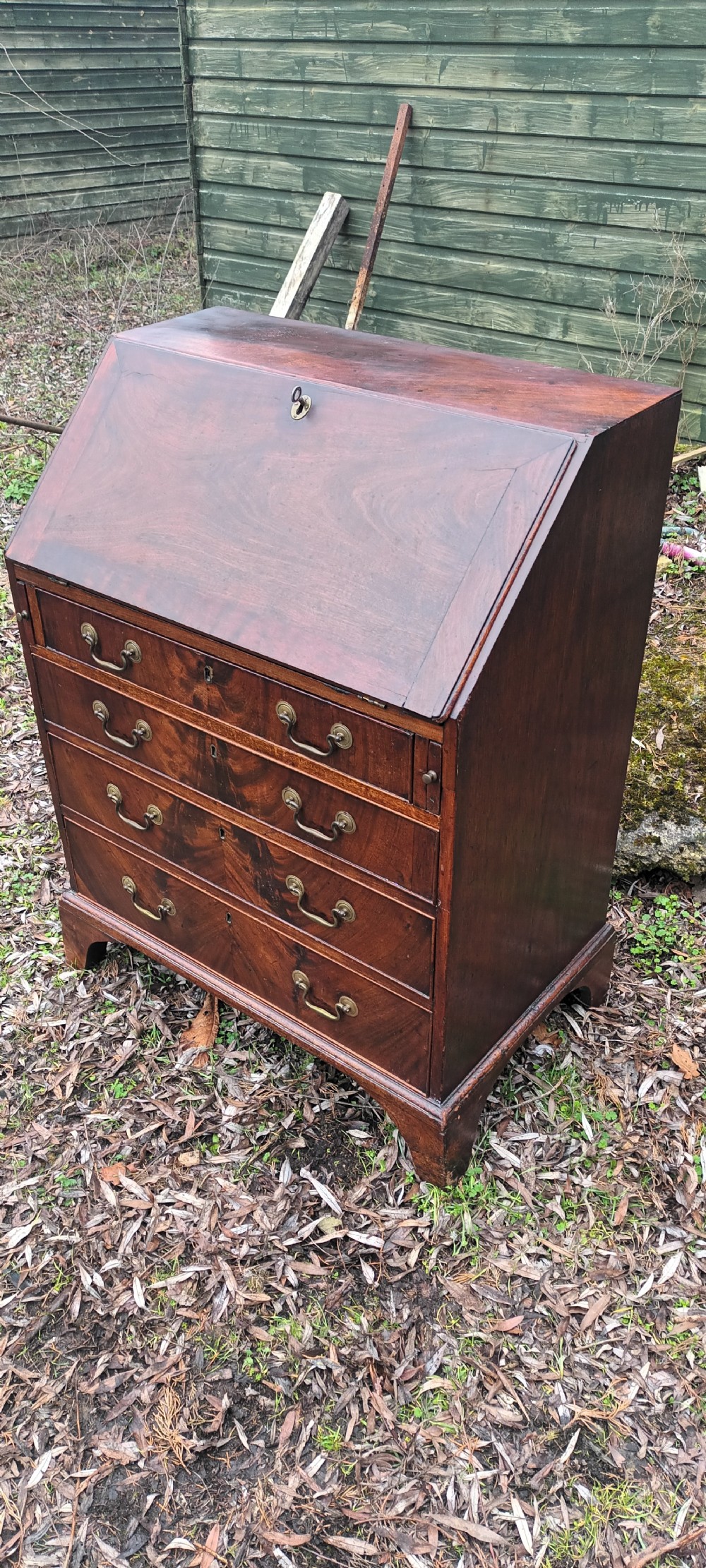 Small Georgian mahogany bureau. View IX