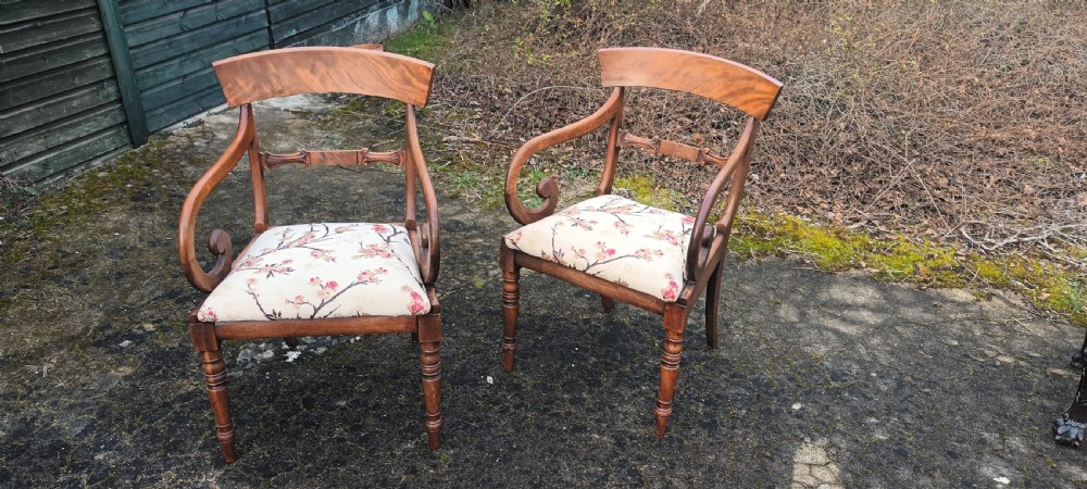 Pair of scroll arm desk armchairs .