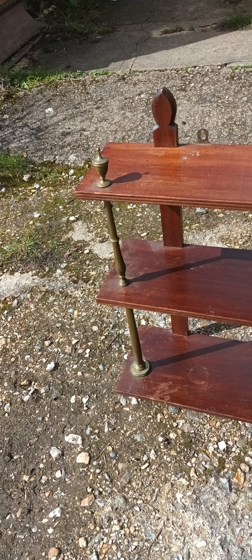Mahogany and brass wall shelves.  View III