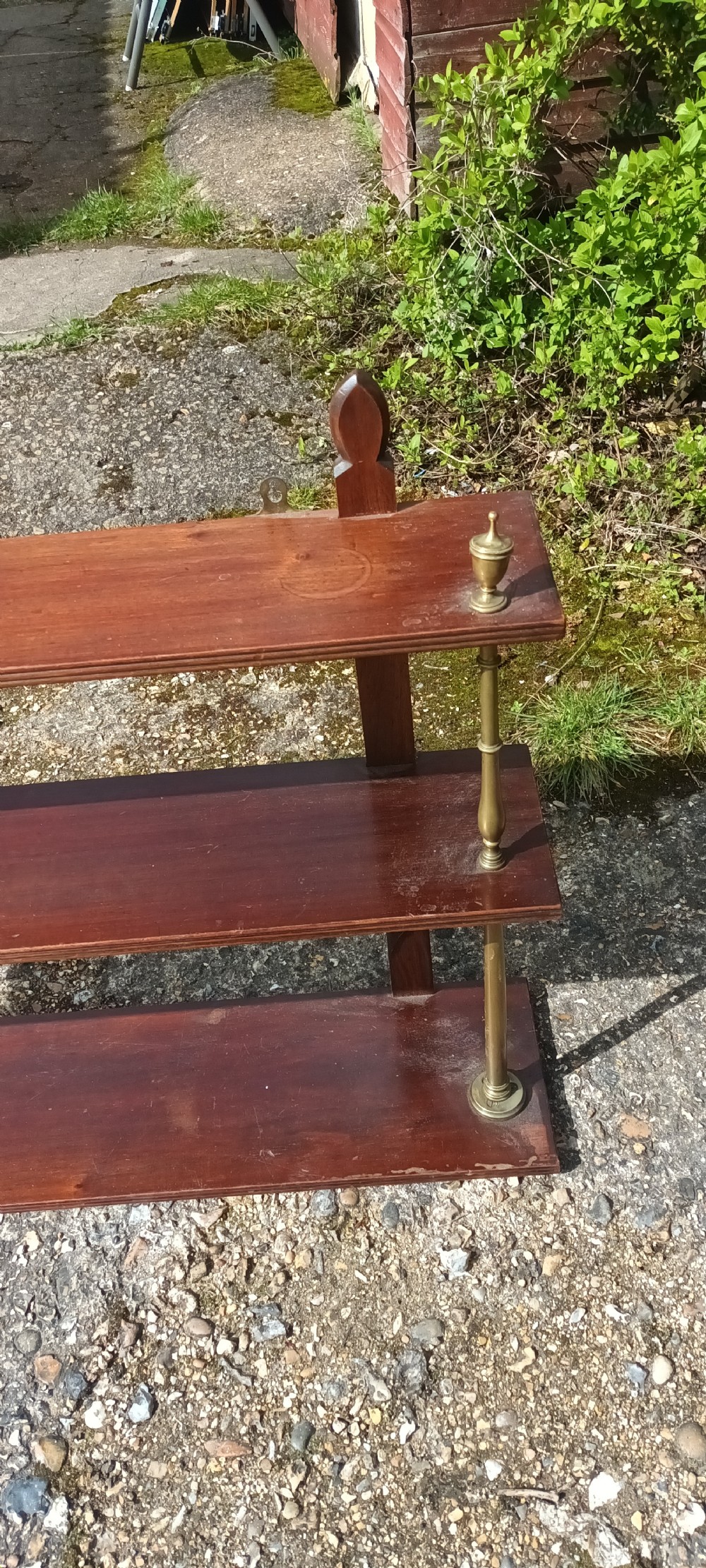Mahogany and brass wall shelves.  View IV