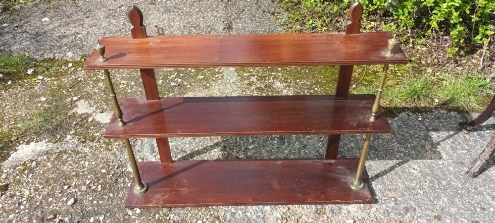 Mahogany and brass wall shelves.  View VI