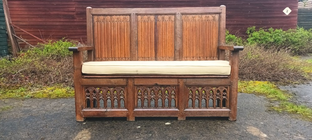 Antique carved oak gothic hall seat. View V