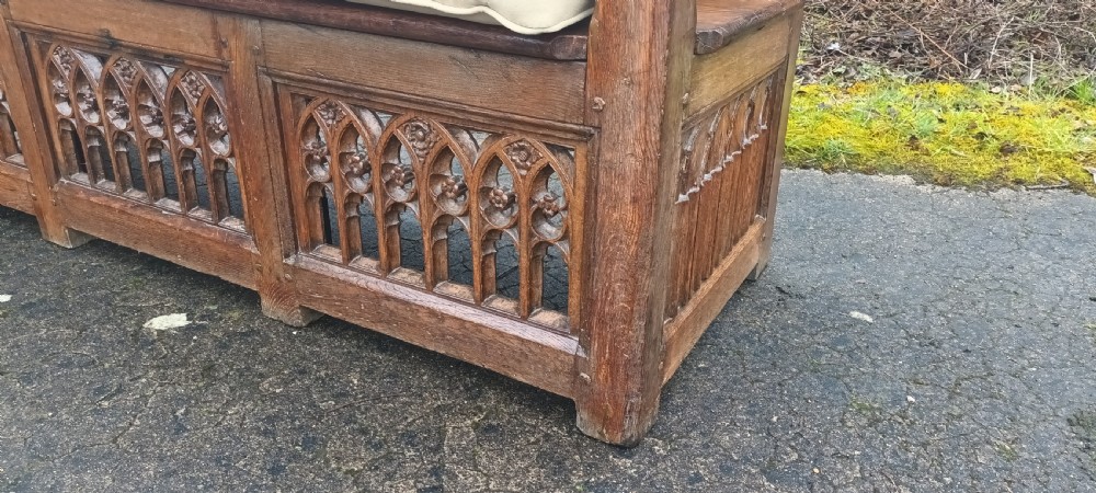 Antique carved oak gothic hall seat. View XI