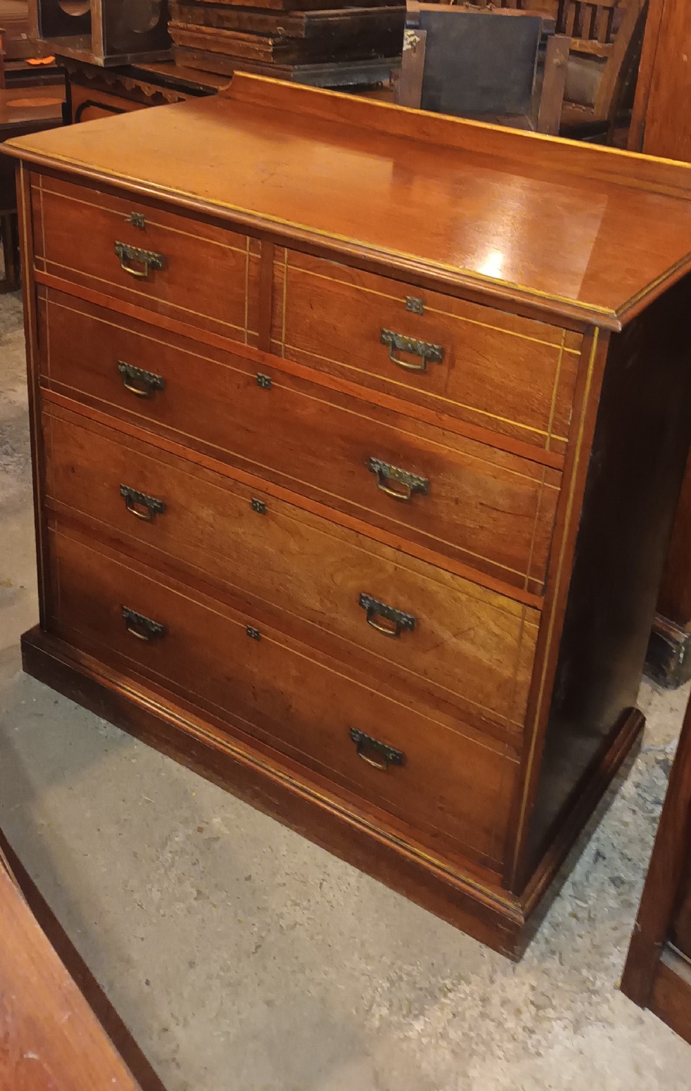 Victorian walnut and highlighted chest of drawers.
