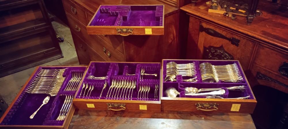 Late Victorian oak fitted cutlery cabinet with some cutlery. By Walker & Hall. View IV