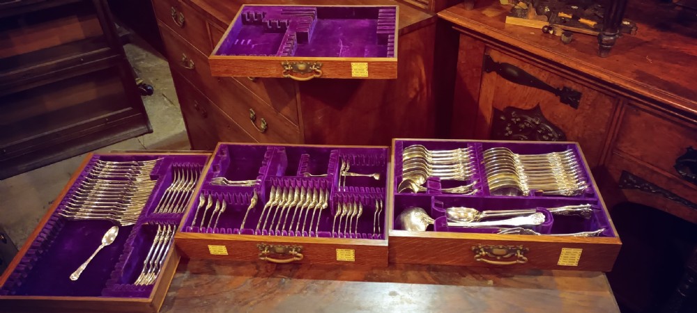 Late Victorian oak fitted cutlery cabinet with some cutlery. By Walker & Hall. View VII