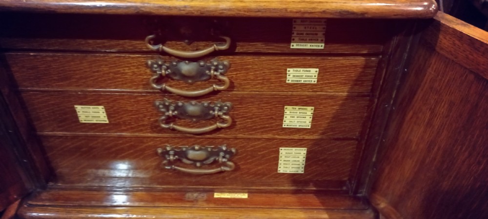 Late Victorian oak fitted cutlery cabinet with some cutlery. By Walker & Hall. View VIII