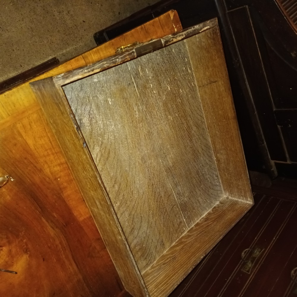An early eighteenth-century figured walnut chest of drawers featuring two short over three long drawers with decorative brass plate handles. View IX