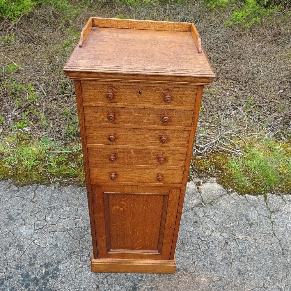 Useful late Victorian oak side cabinet  View II