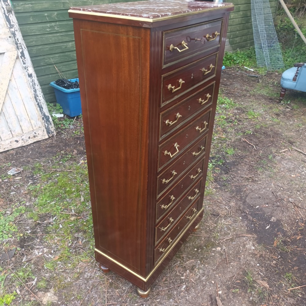 Marble top brass mounted semainier mahogany Wellington type chest. View IV