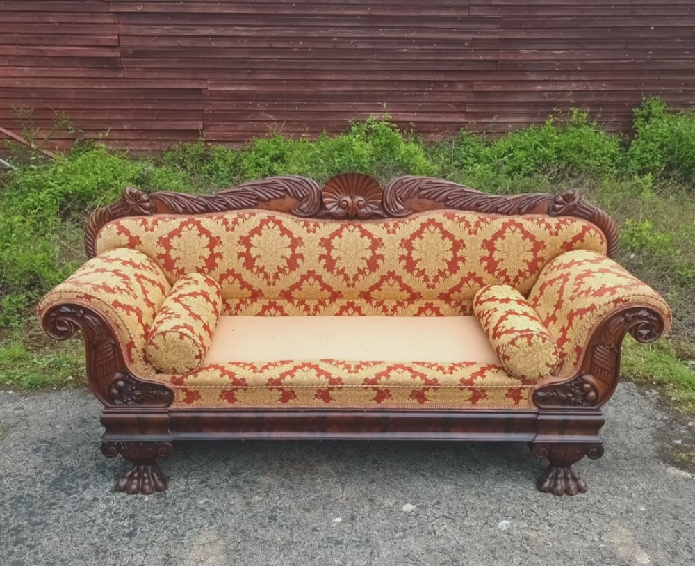 Large and impressive 19th century carved Mahogany hall sofa.