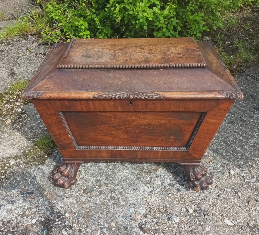 Regency mahogany Cellerette with good carved claw feet.