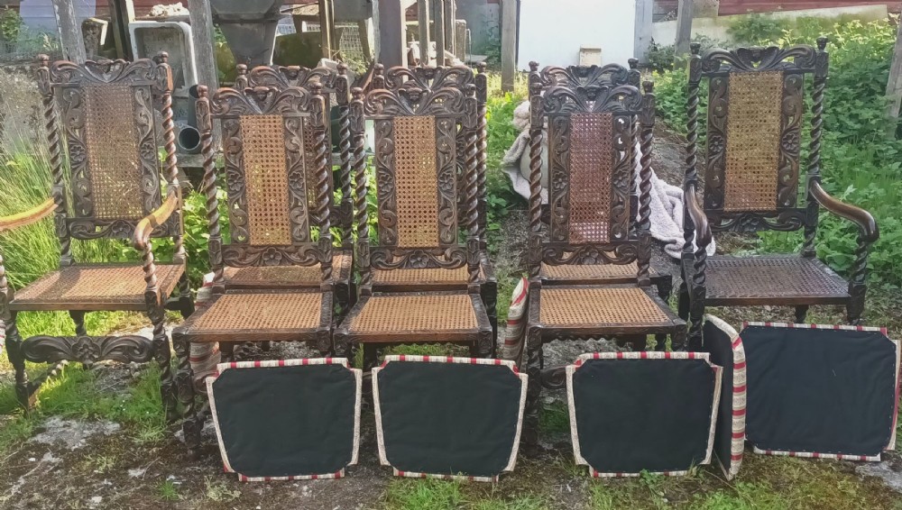 Set of 8 carved oak dining chairs.