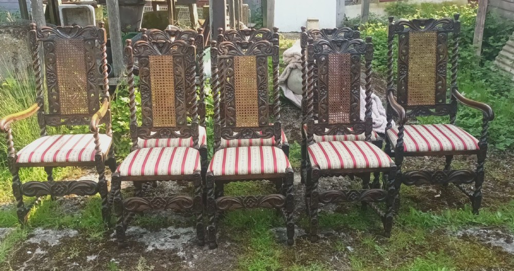 Set of 8 carved oak dining chairs. View II