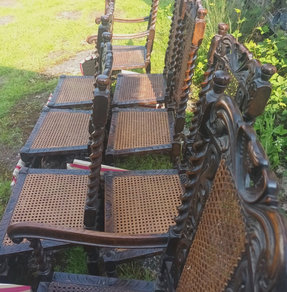 Set of 8 carved oak dining chairs. View X