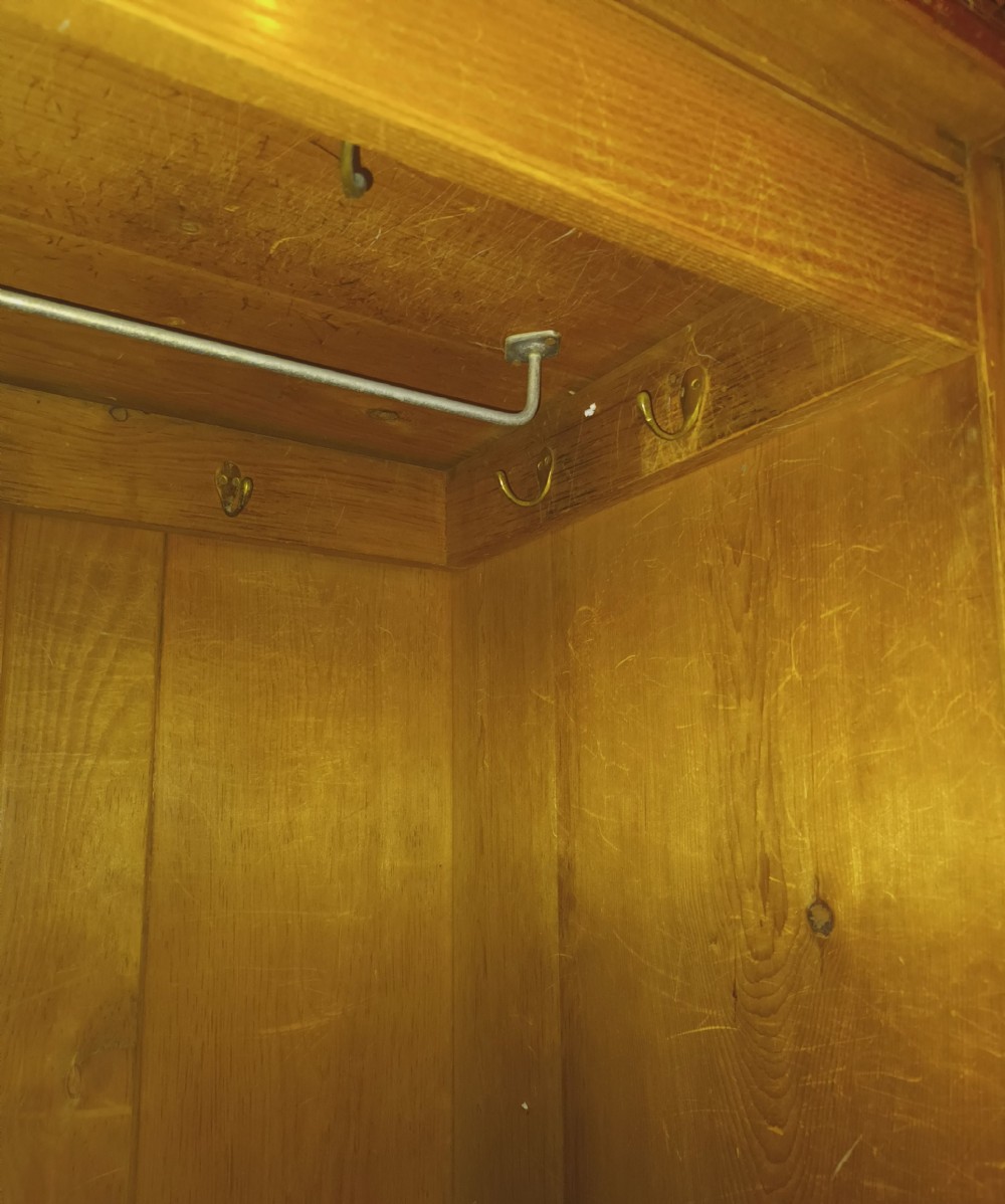 A large Victorian triple-door ash wardrobe featuring geometric marquetry inlay panels, a central mirrored door, and a heavily moulded upper cornice. View XXVI