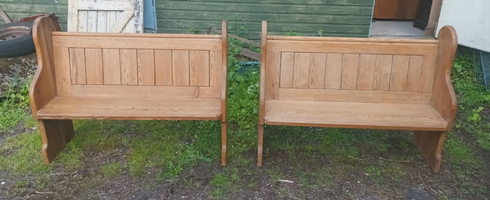 Pair of late Victorian pitch pine kitchen pews with loose cushions. 