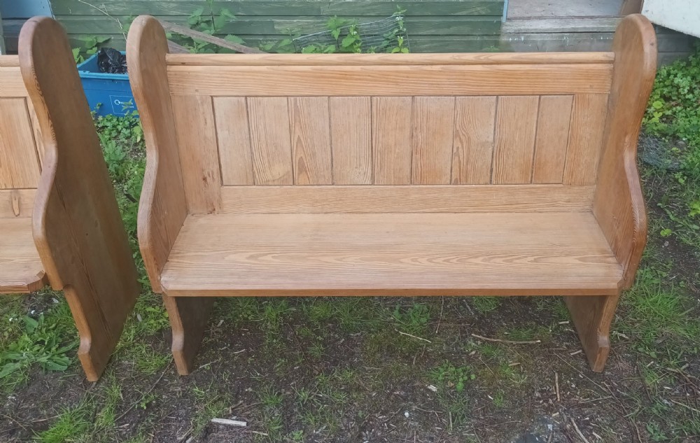Pair of late Victorian pitch pine kitchen pews with loose cushions.  View III