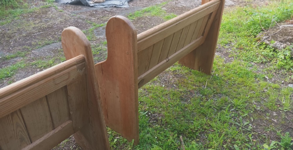 Pair of late Victorian pitch pine kitchen pews with loose cushions.  View IV
