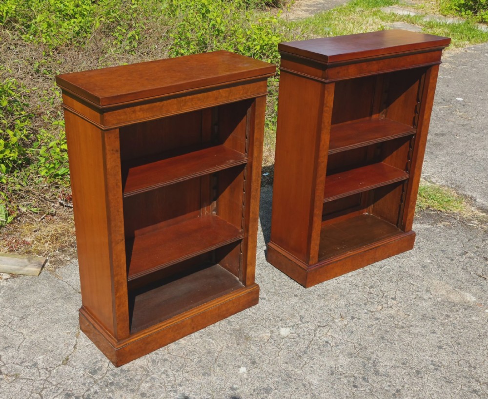 Pair of small walnut open front bookcases.