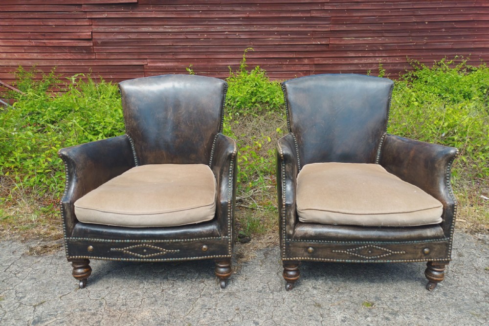Pair of studded leather upholstered armchairs.  View II