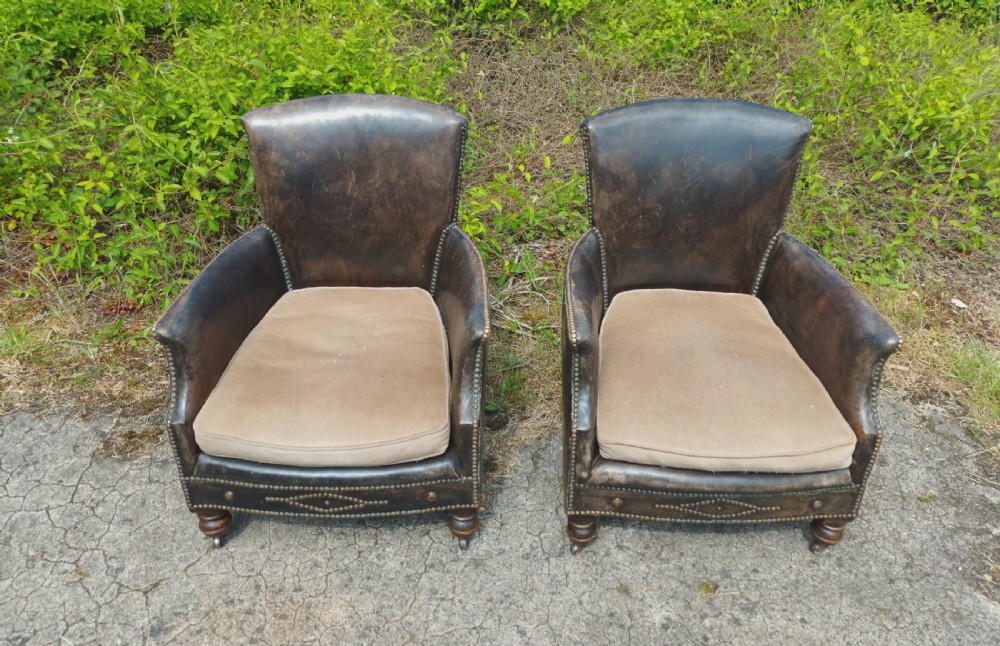 Pair of studded leather upholstered armchairs.  View III