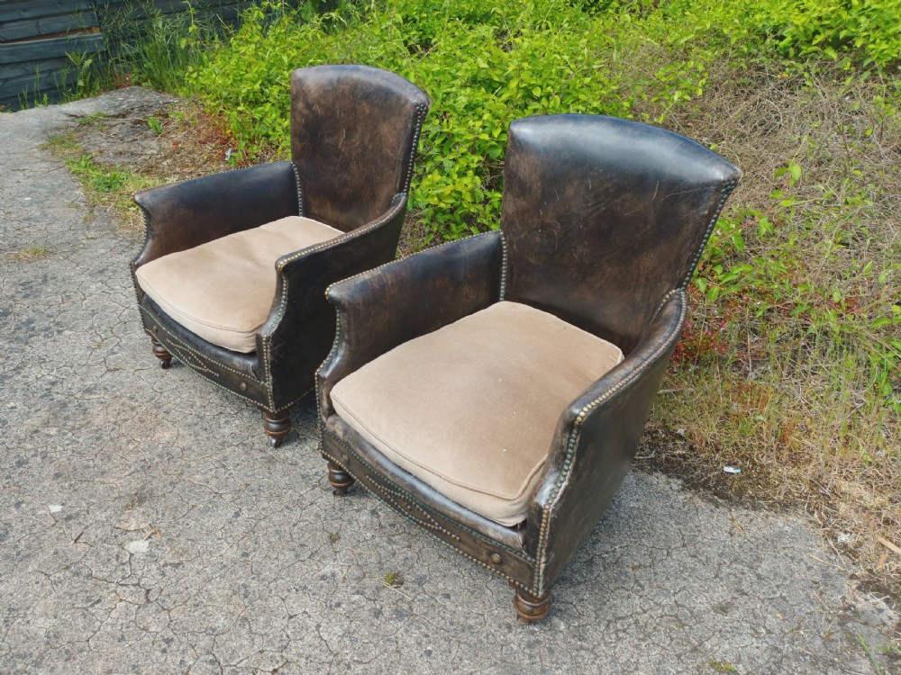 Pair of studded leather upholstered armchairs.  View IV