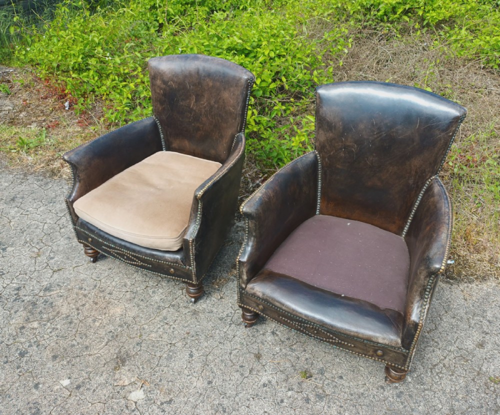 Pair of studded leather upholstered armchairs.  View IX