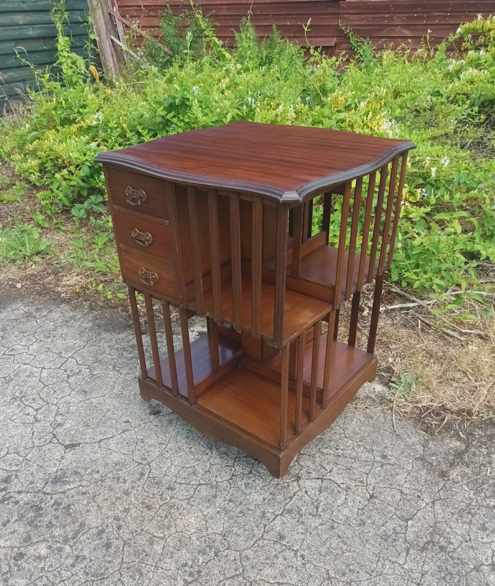 Edwardian revolving bookcase fitted with drawers. 