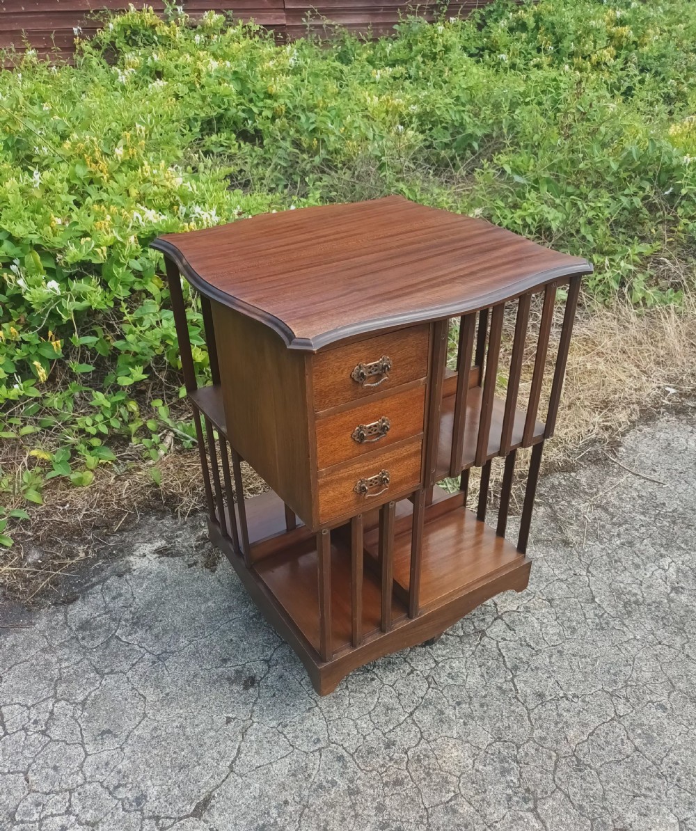 Edwardian revolving bookcase fitted with drawers.  View IV