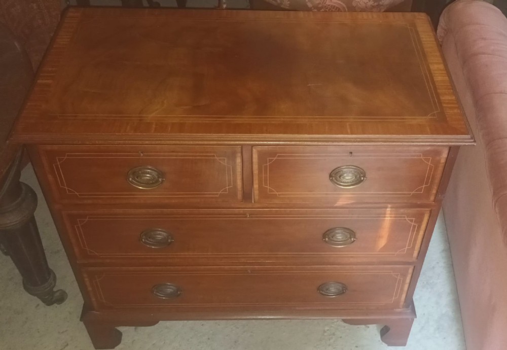 Small 19th century inlaid mahogany chest of drawers.  View VIII