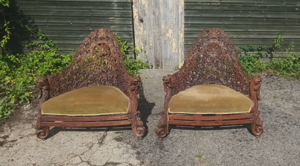 Pair of late 19th century Anglo Indian carved armchairs. 