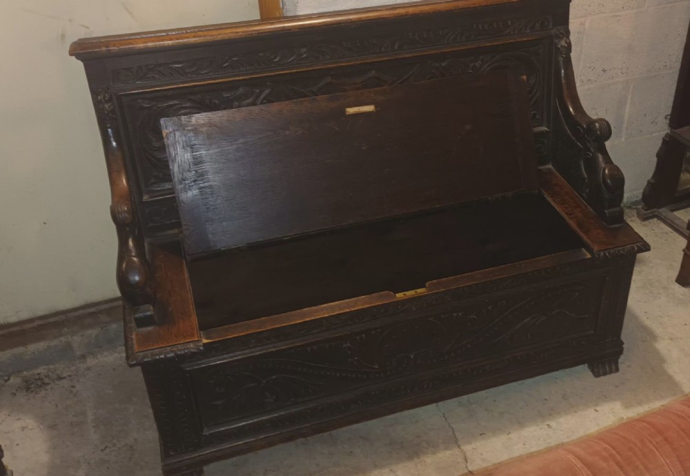 Late Victorian carved oak hall seat. View III