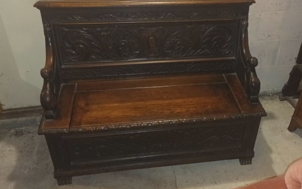 Late Victorian carved oak hall seat. View IV