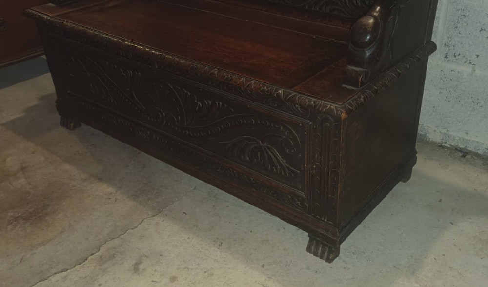 Late Victorian carved oak hall seat. View VII