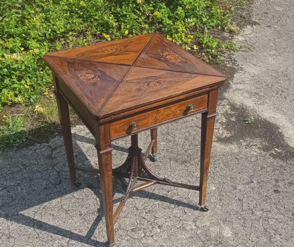 Late Victorian inlaid rosewood envelope games table. 